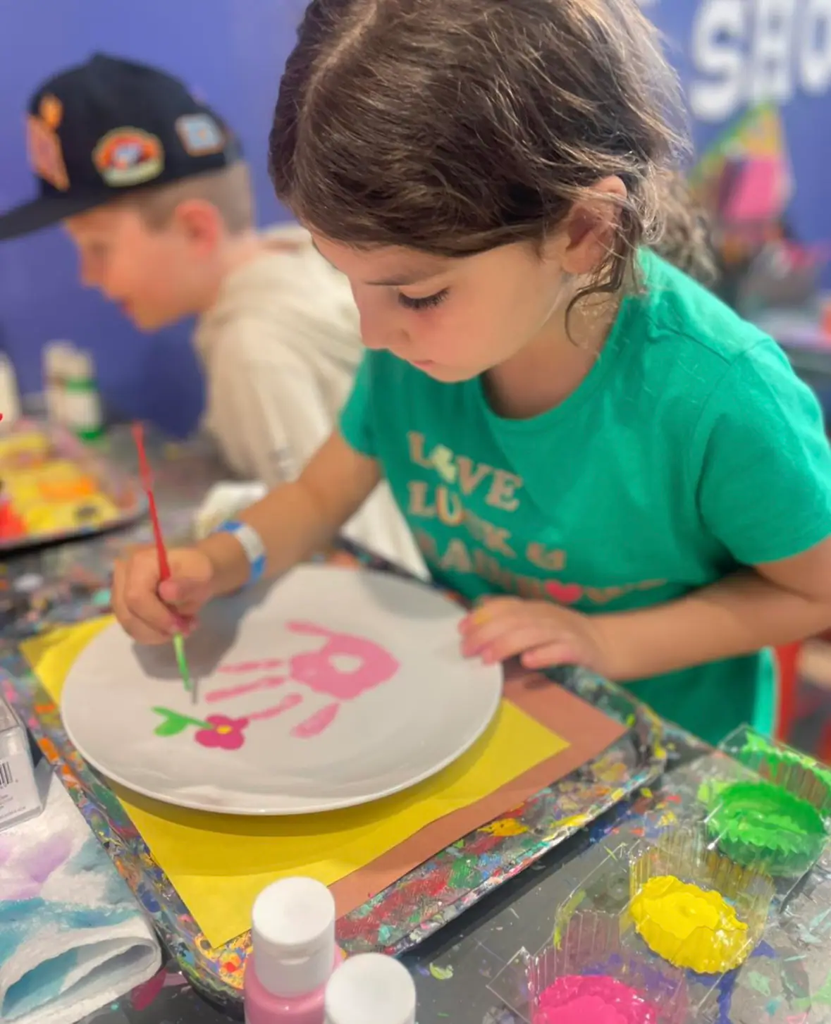 Children exploring a themed imaginative play area at Minnesota Playseum.