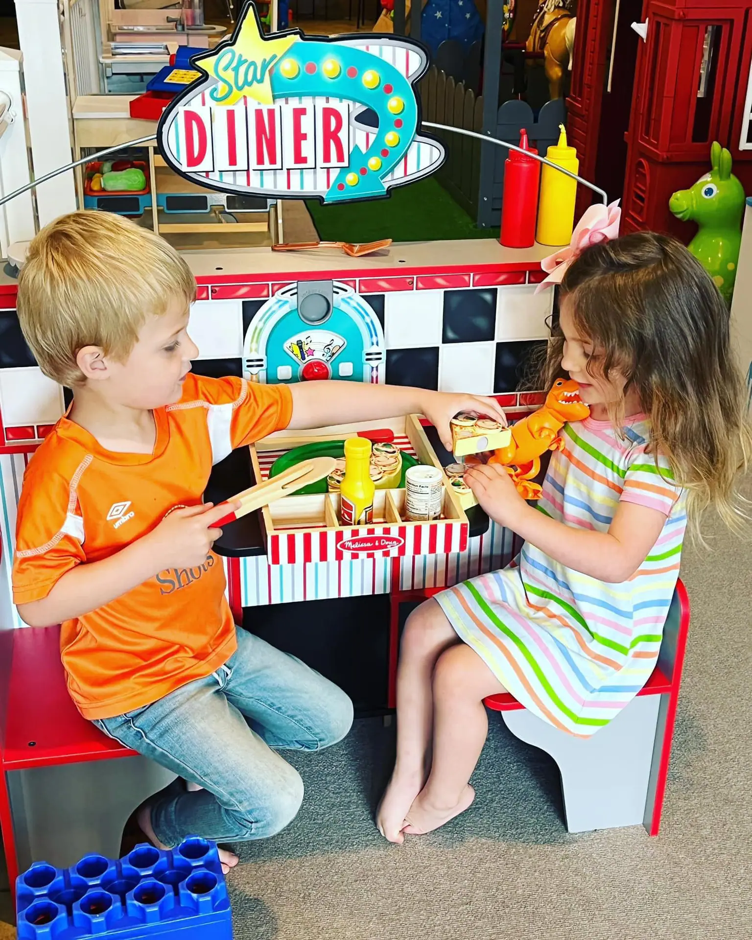 Pretend diner play setup at Little Doodles Play Cafe.