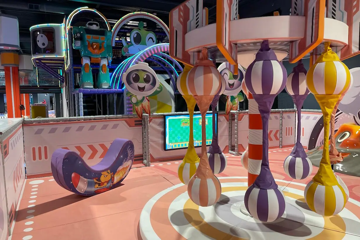 Toddler-friendly activity area with padded hanging play features at Catch Air Jersey City.