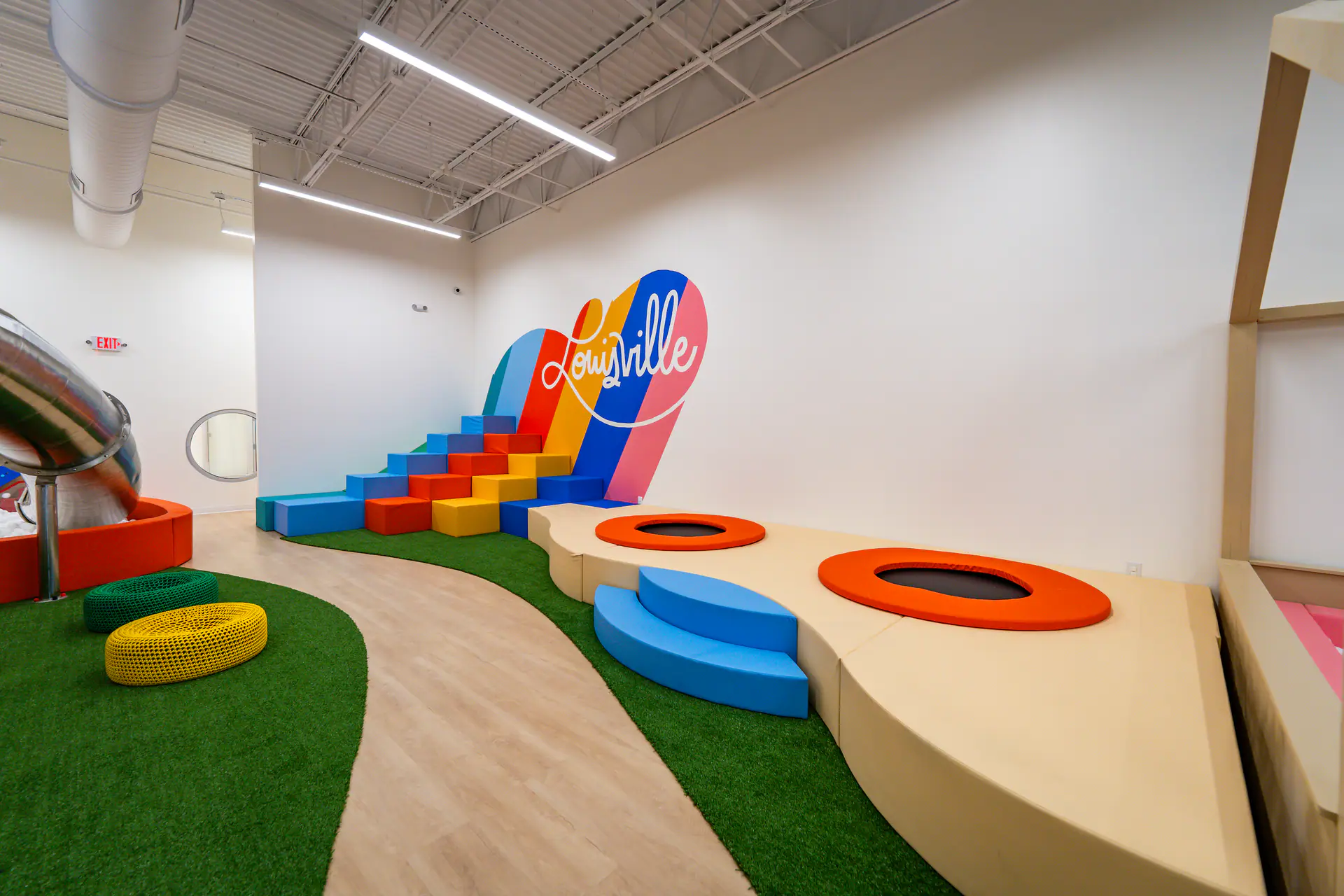 Soft-play and toddler-focused play area inside Playground Abode.
