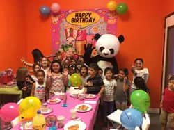 Birthday party table decorated inside High 5 Indoor Playground.