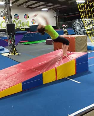 Children using gymnastics equipment at Treehouse Gymnastics.