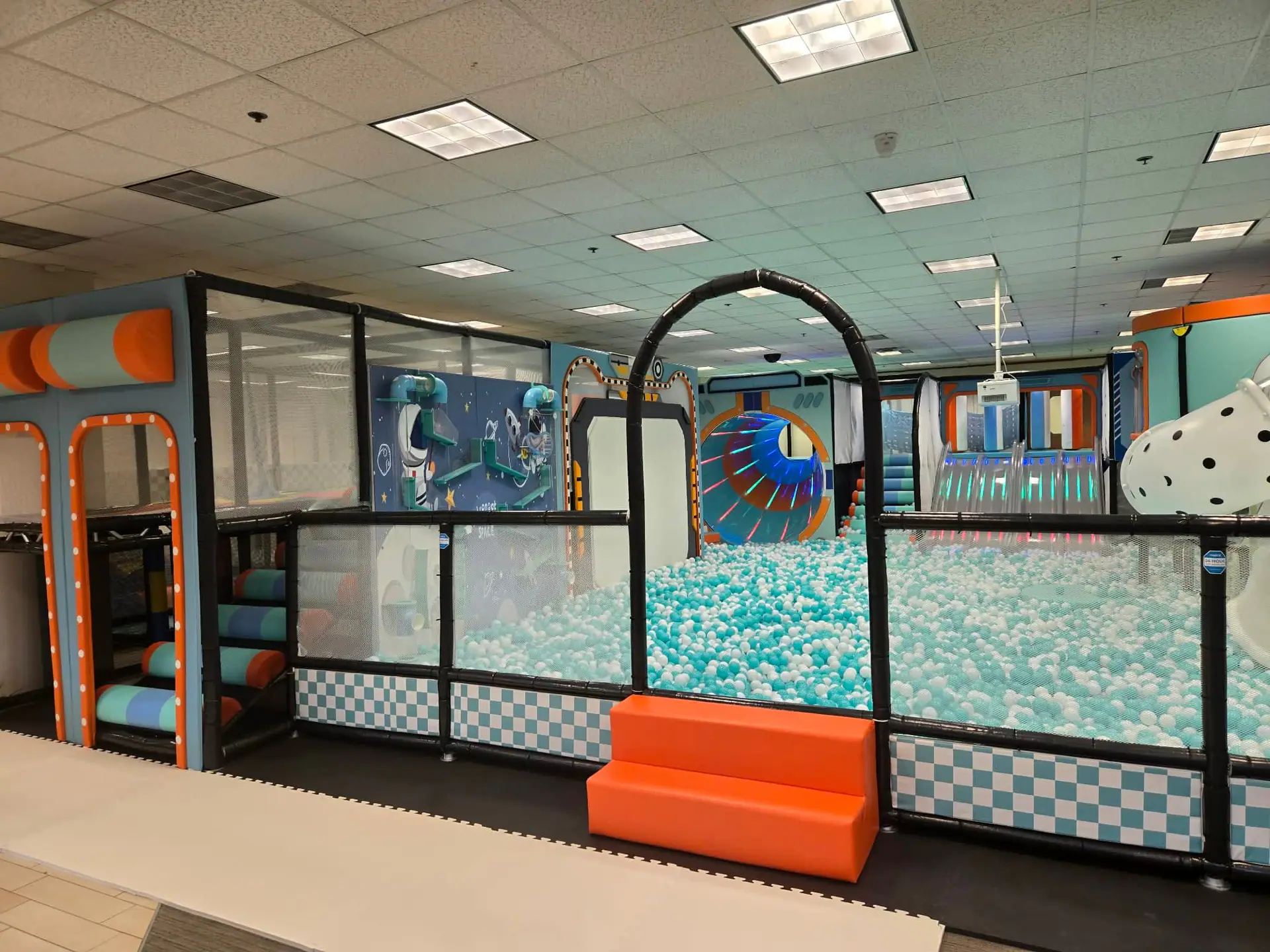 Indoor obstacle and play features inside ProKids Place.