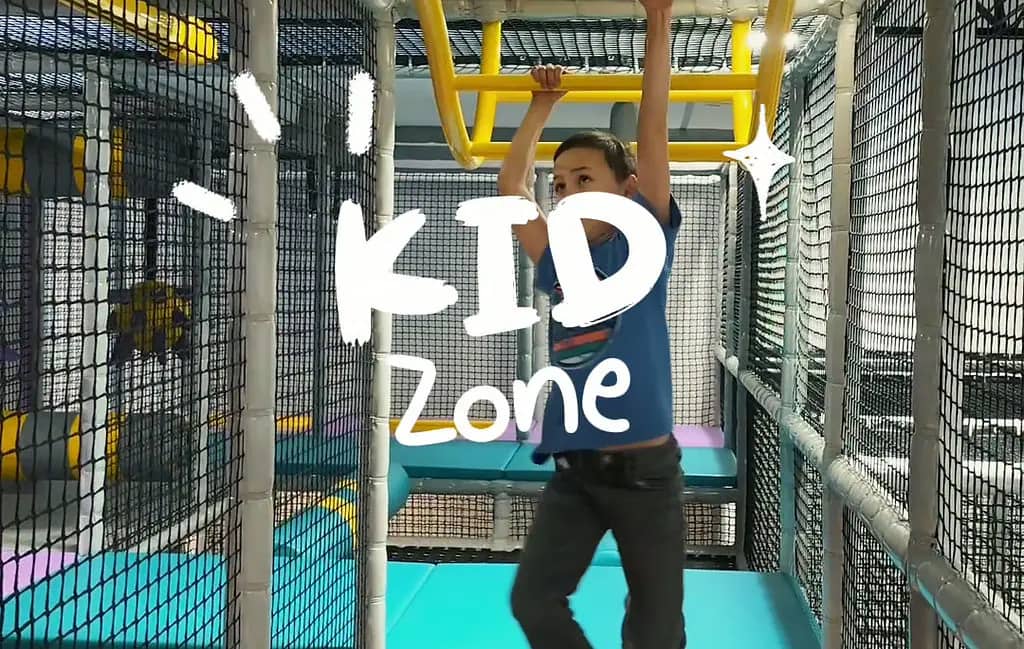 Indoor play structure and open play floor at Kid Zone Idaho Falls.