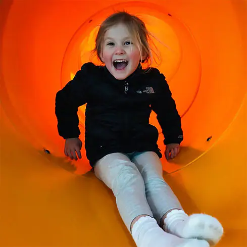 Orange slide at Phelps Youth Pavilion in Waterloo.