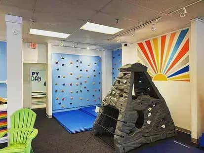Rock wall and volcano-themed climbing area at Let's Play in Kittery.