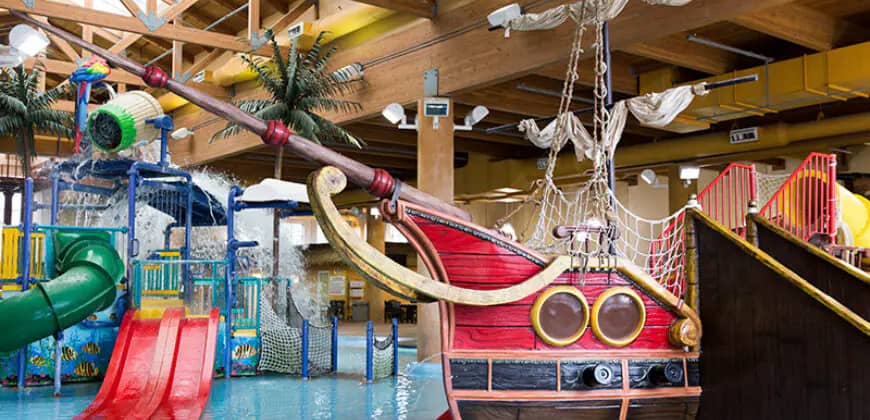Pirate ship play structure and small slides inside Boji Splash Indoor Waterpark.