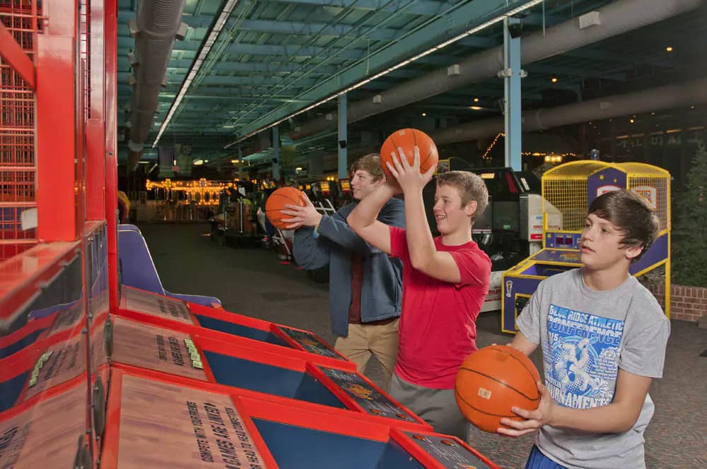 Kids playing basketball arcade games at The Factory Franklin.