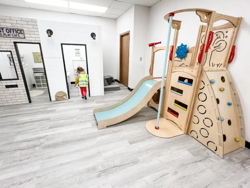 Indoor play structure and pretend-play area at Brewed Imagination in Marion