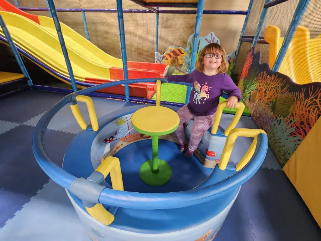 Small spinner feature and slides inside Sheridan County YMCA Playland