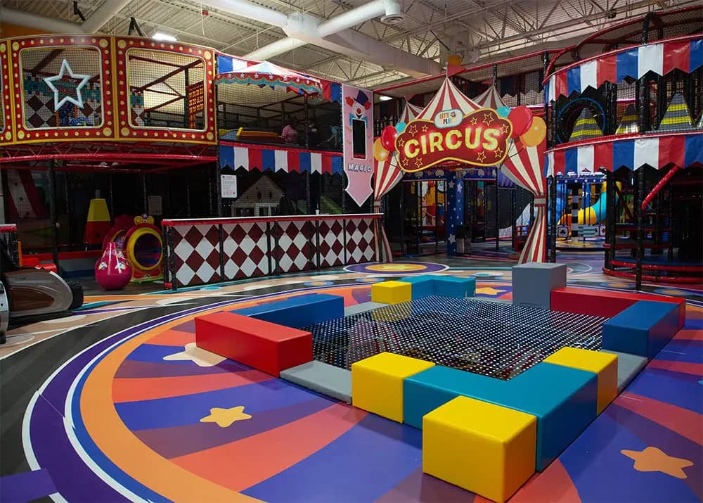 Central circus-themed play floor and toddler play area at Let's Play Birmingham.