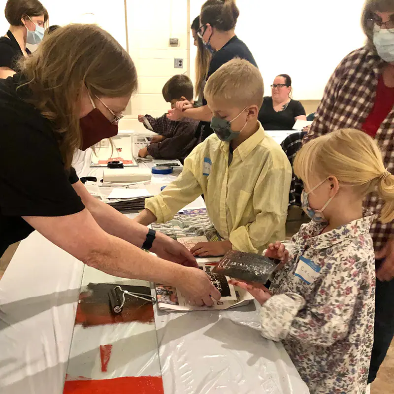 Children taking part in a hands-on activity connected to the Children's Discovery Center at Allen County Museum.