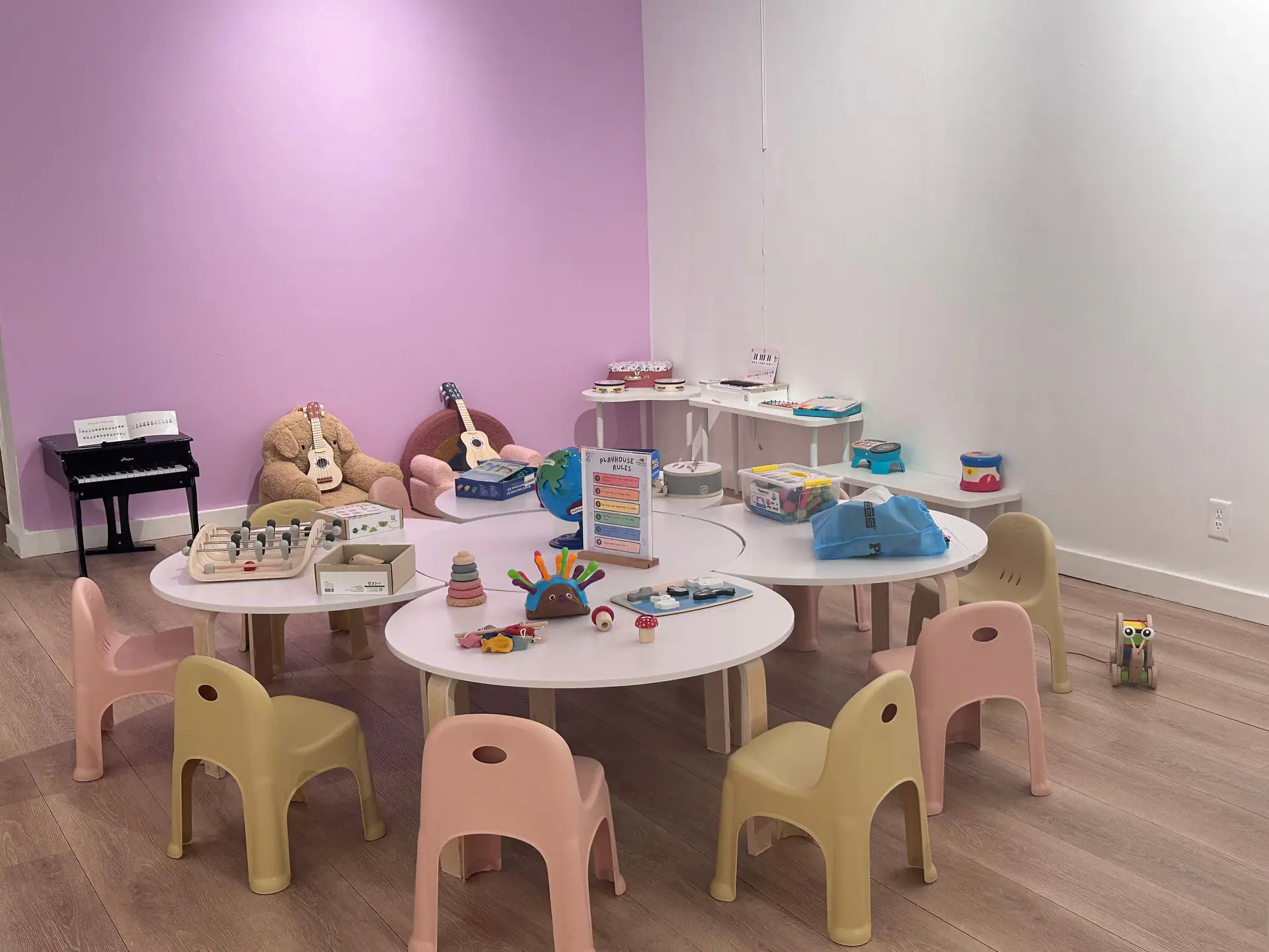 Tables and activity area inside Little Stars Toy Store & Playhouse.