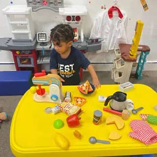 Pretend kitchen setup inside The Tot Spot Fun Factory.