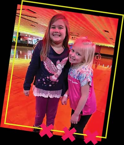 Children roller skating on the rink at Firehouse Skate 'N Play.