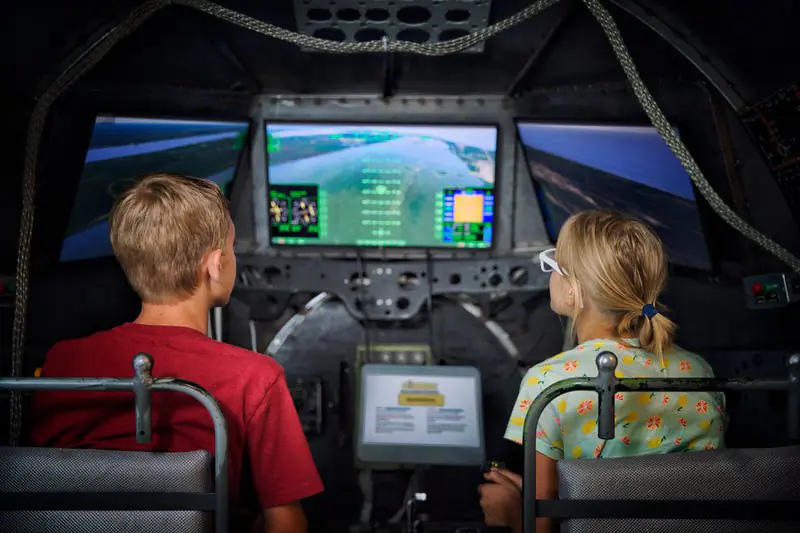 Children using the space shuttle simulator at EUREKA! McConnell Science Museum.