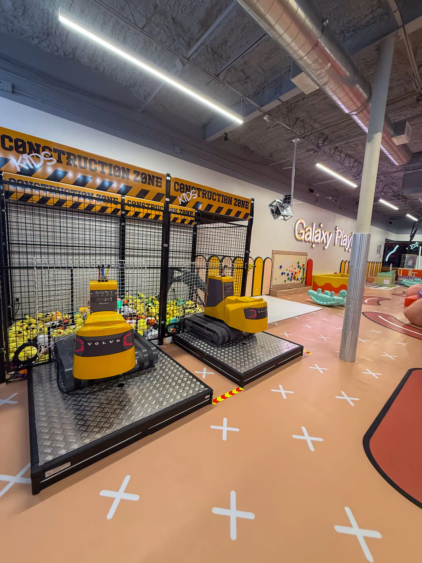 Large indoor play area at Galaxy Playland Houston with climbing features.