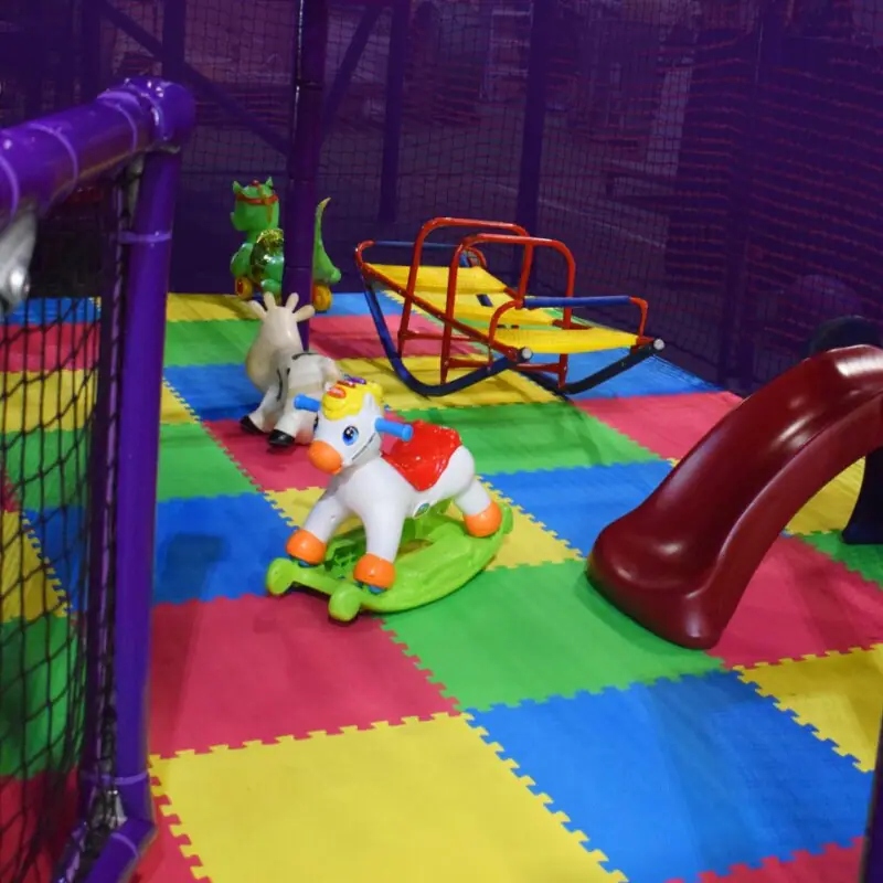 A younger-child play area with padded equipment inside Funagin's.