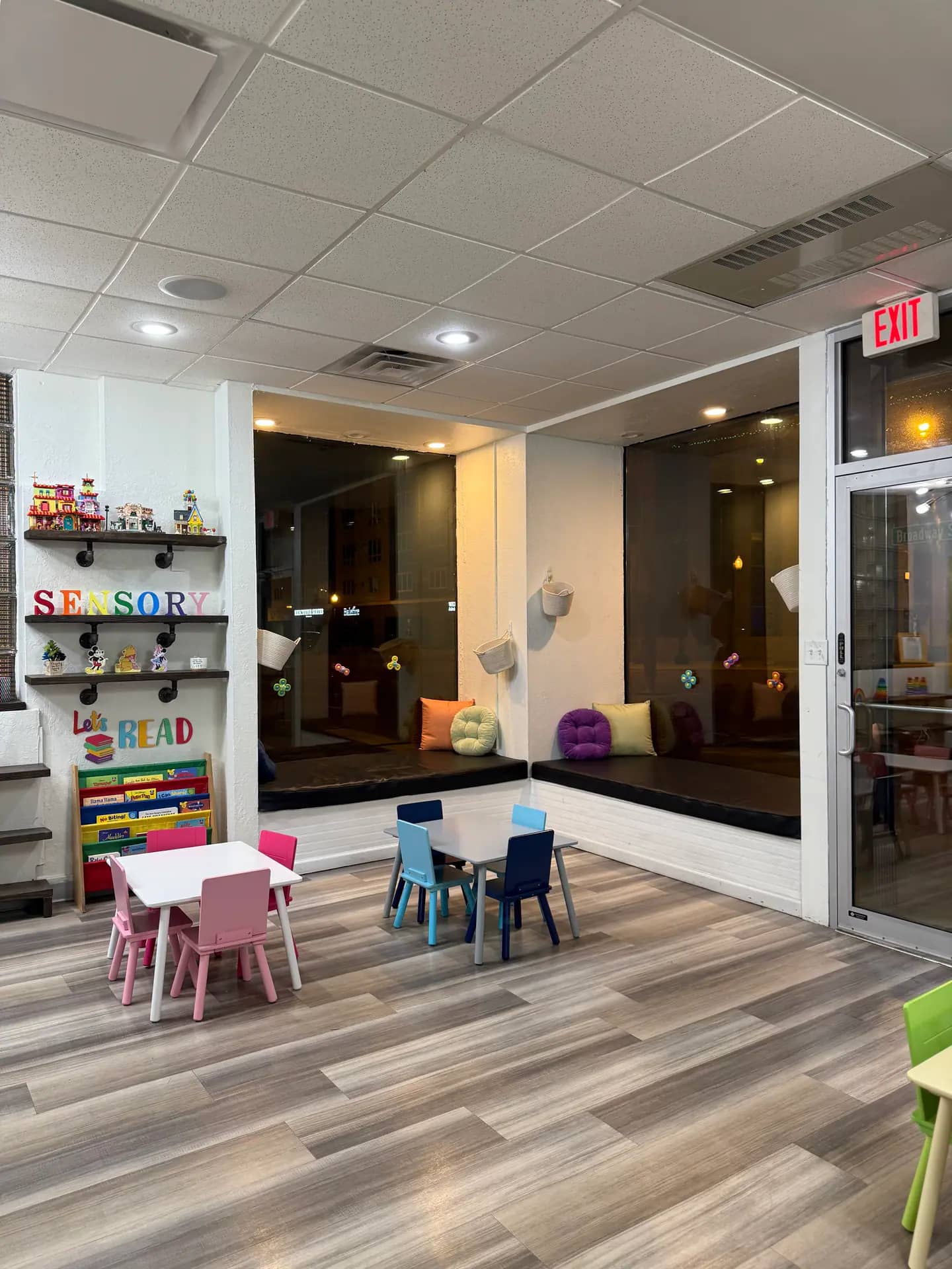 Reading nook and child-sized seating area at Sensory Open Play Group.