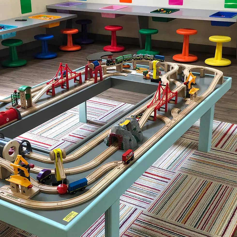 Train table and sensory activity area at Kid & Caboodle Play.