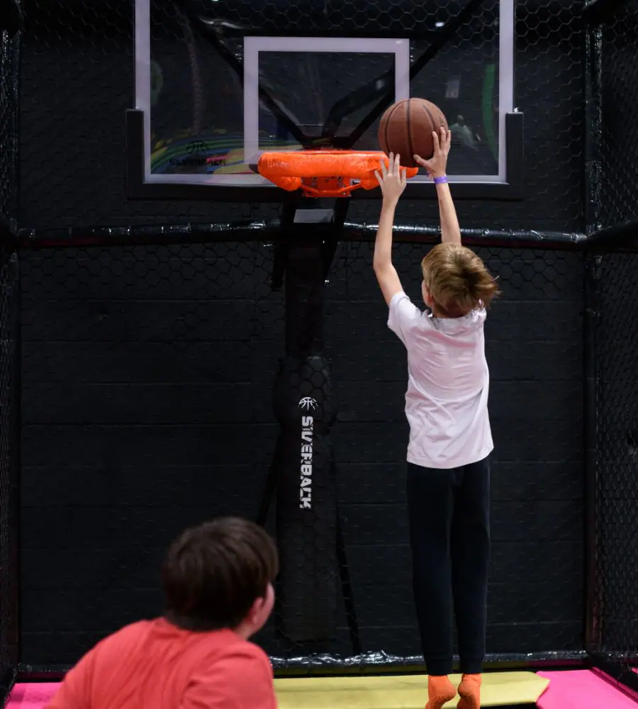 Kids using another indoor trampoline attraction at Fun City Adventure Park.