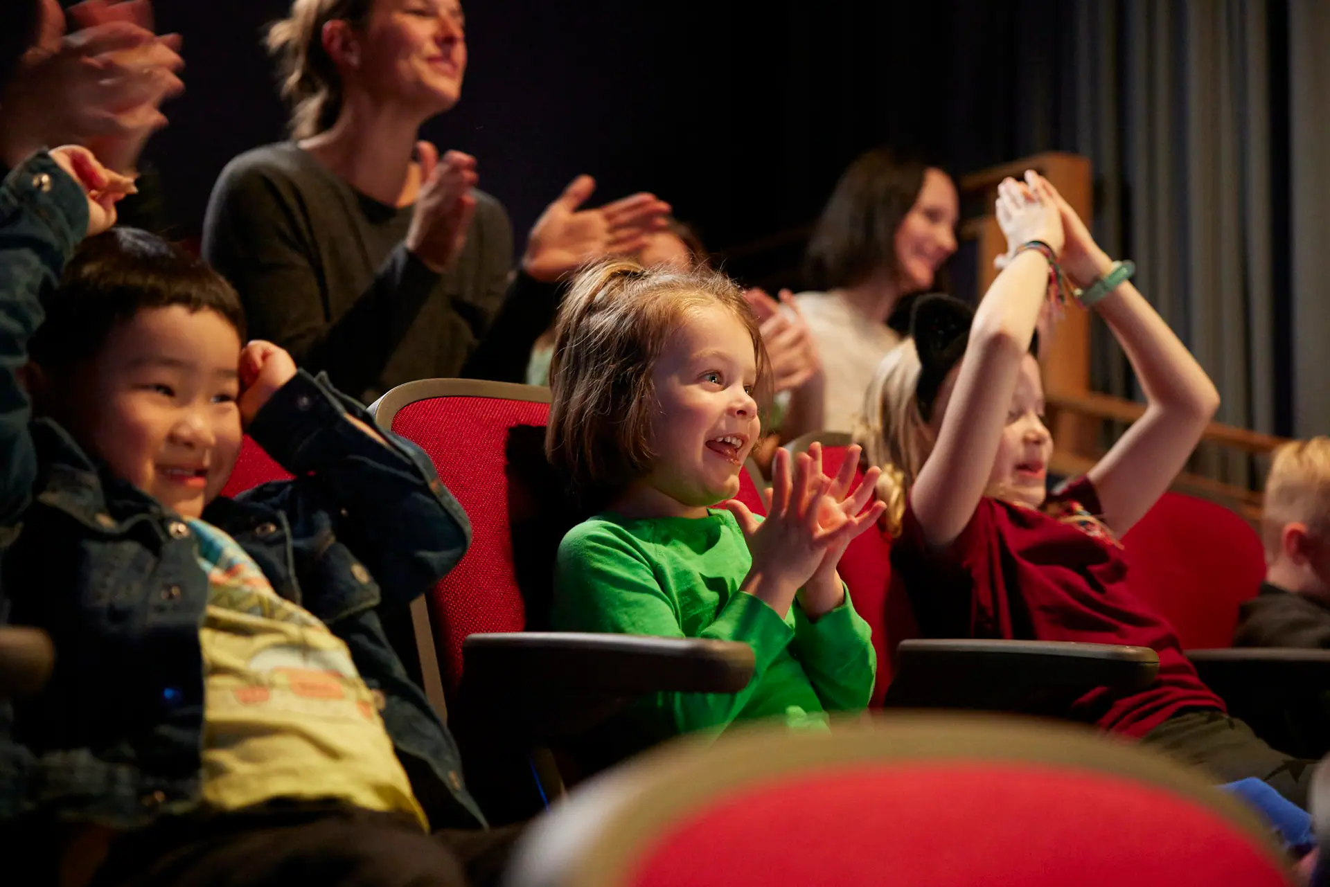Children enjoying a performance at CMTM theatre.
