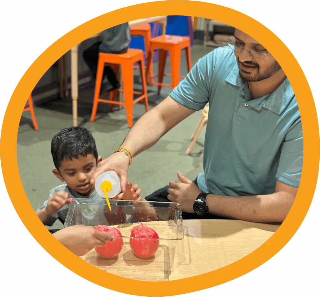 Adult and child exploring a guided activity at TCMU Greenville
