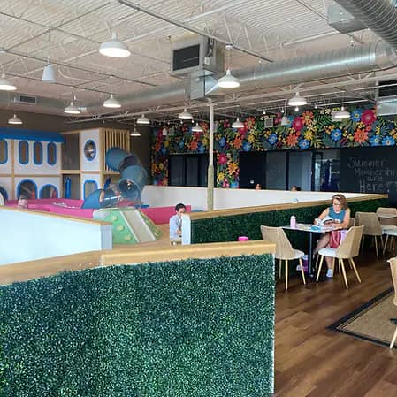 Cafe seating overlooking the play area at run+play kids cafe.