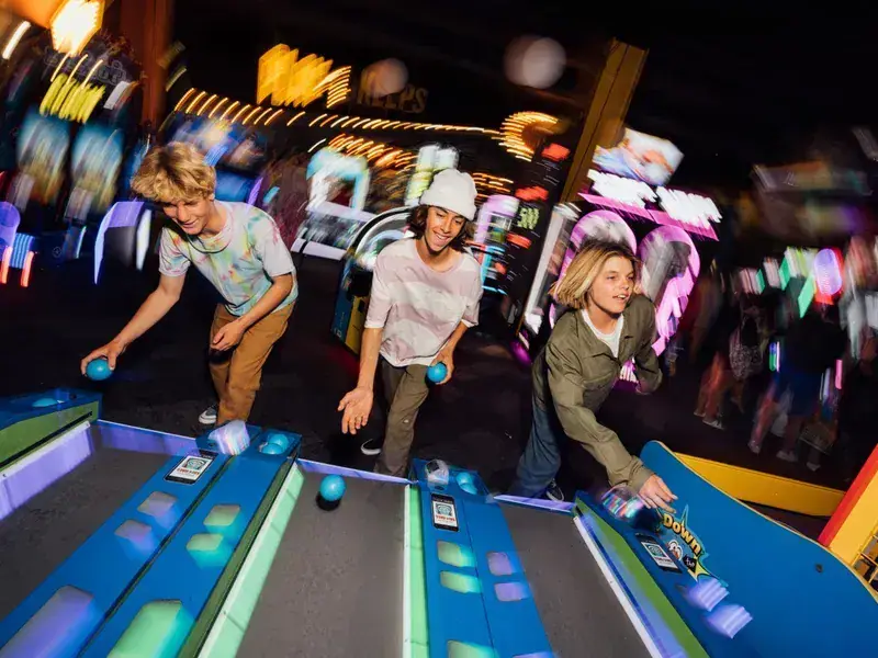 Kids playing arcade games at Fun Factory Kona Coast.