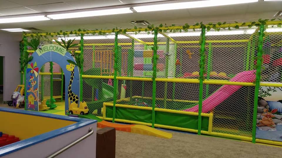Slides and climbing features at Kiddie Jungle Mentor.