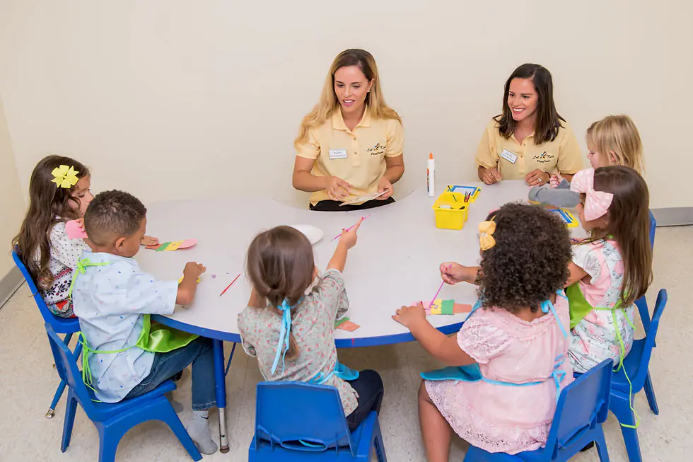 Children doing a craft activity at Let's Bee Kids PlayCenter.