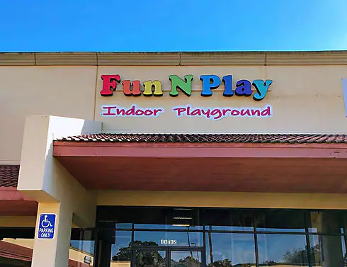 Exterior storefront sign for Fun N Play Indoor Playground in Cypress.