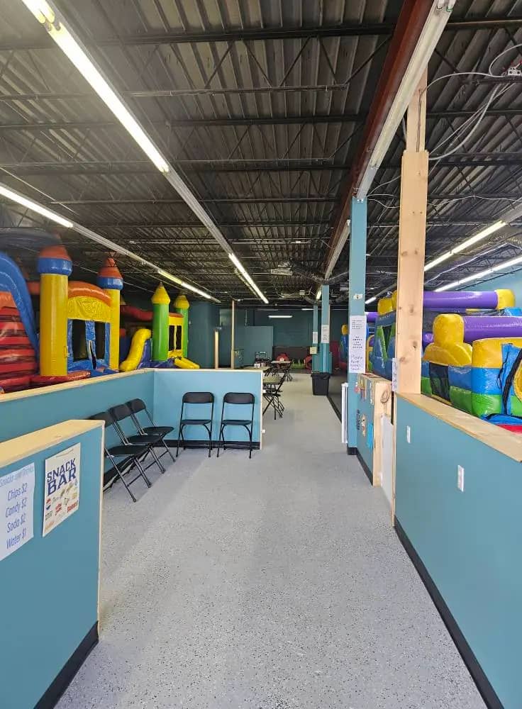Walkway and seating area inside Level Up Bounce.