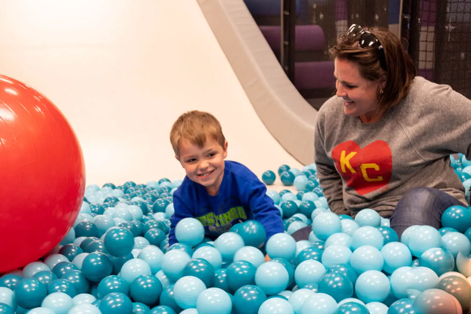 Children playing near the ball-pit area at Club Run & Jump.