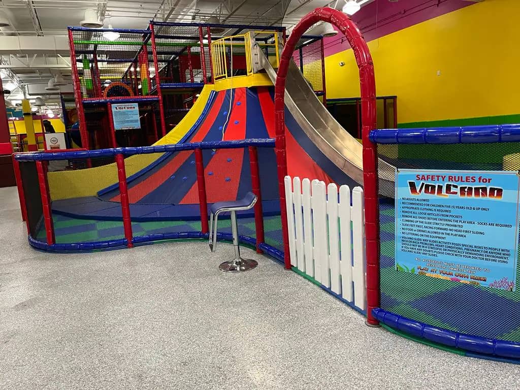 Large volcano-style slide attraction at La La Land Royal Palm Beach.