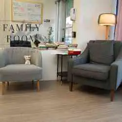 Adult seating area inside Family Room on Broadway.