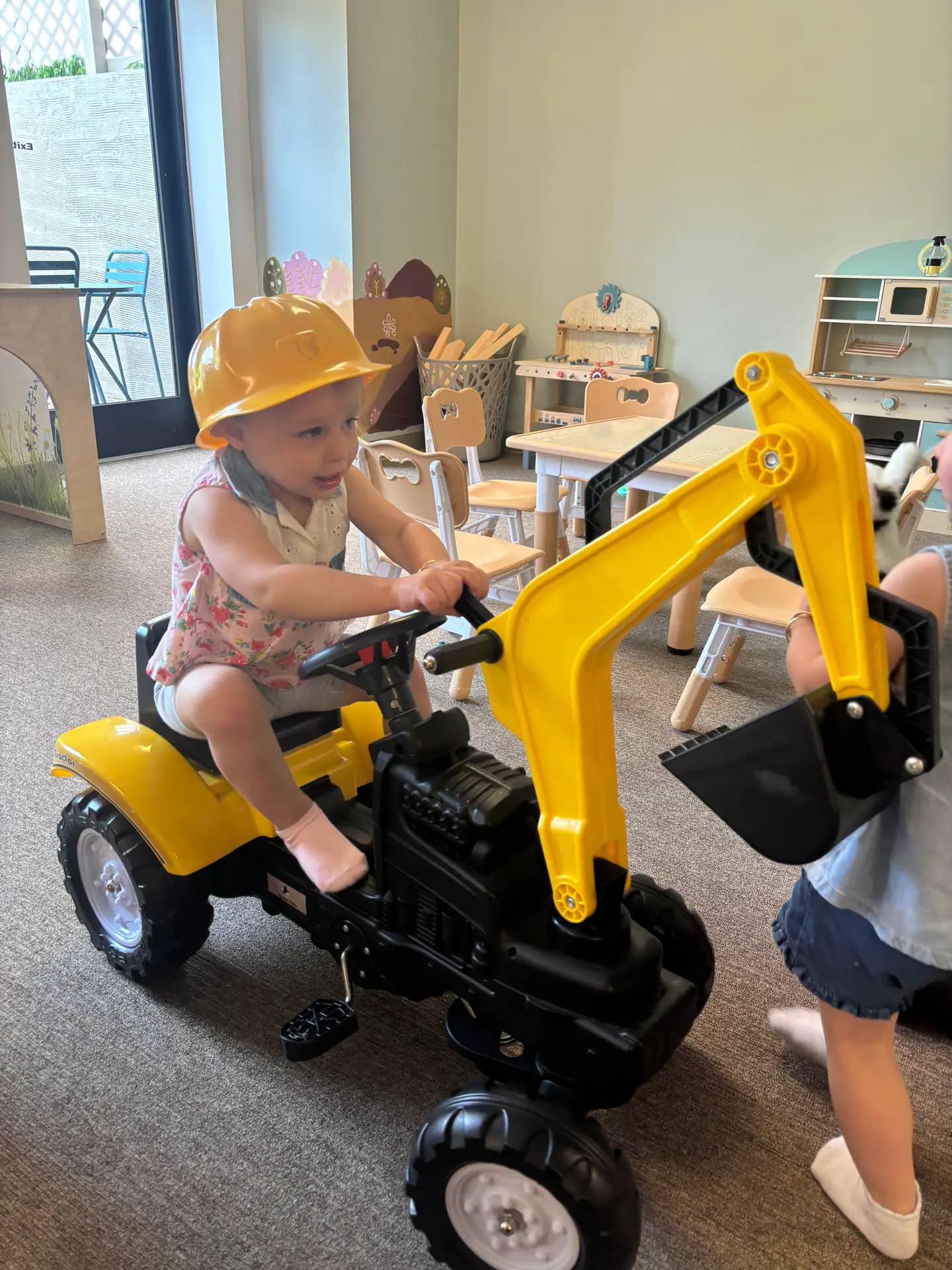 Another view of Sunshine Play Café's indoor play setup and seating.