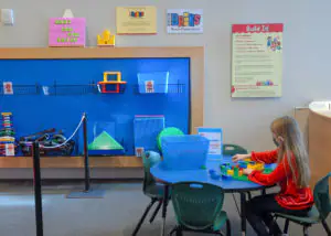 Children exploring hands-on stations inside the Family Interactive Gallery.