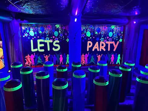 Party room with glow decor at Xplore Family Fun Center.