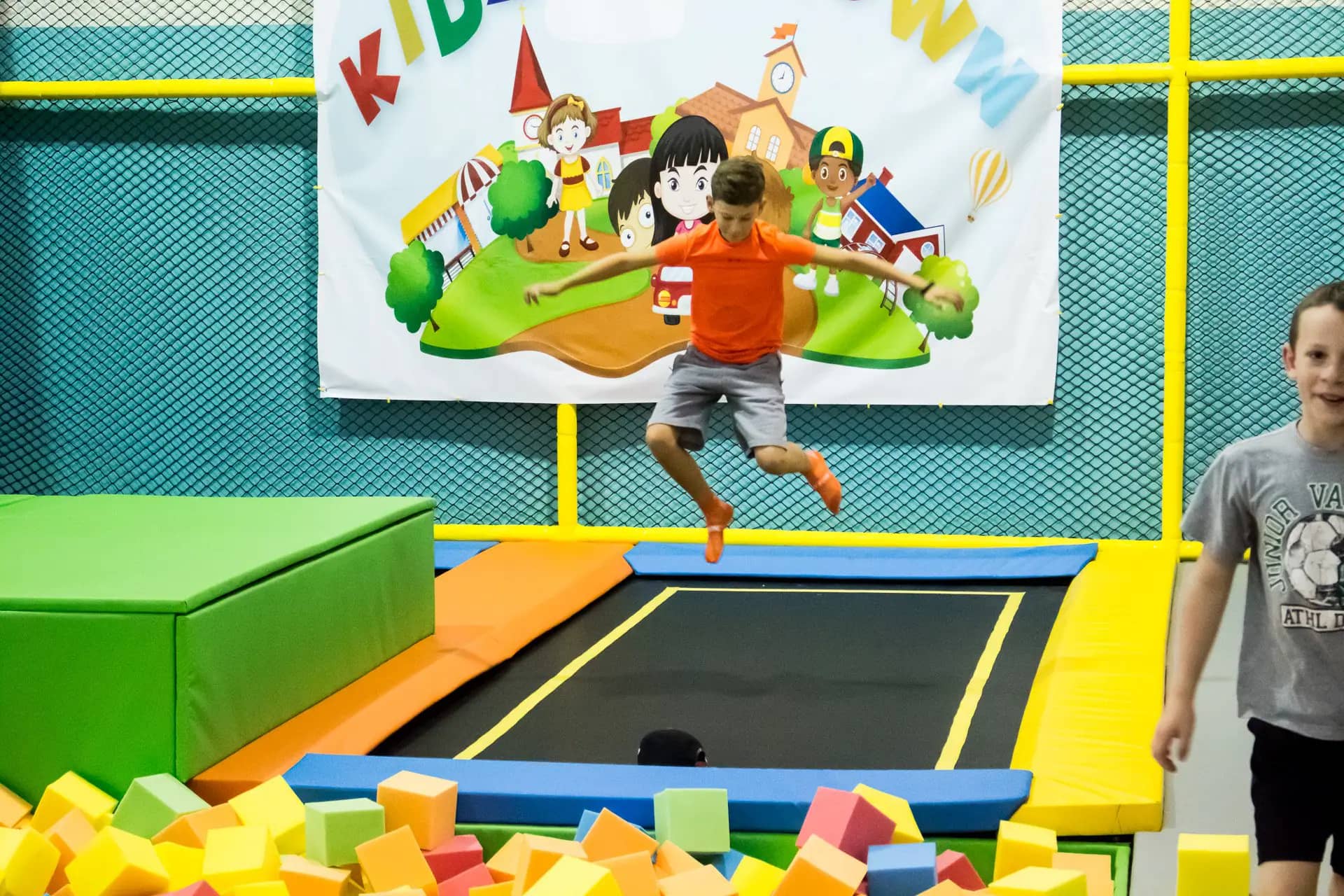Mini trampoline and foam-pit style area at Kidz Funtown.