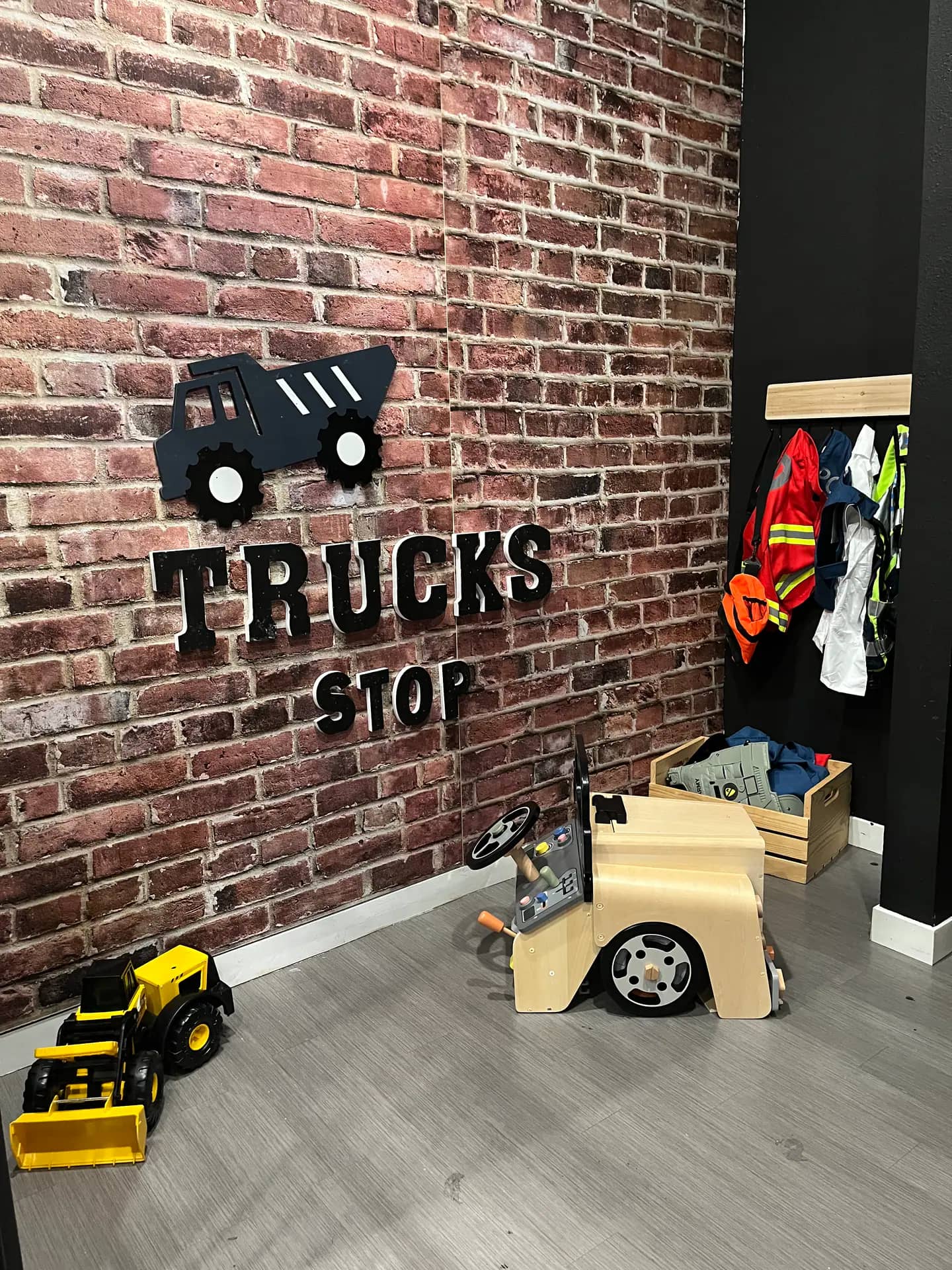 Construction-themed pretend-play corner inside Fargo Kids Play Museum.