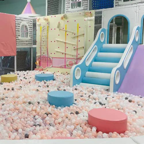 Ball pit, slides, and indoor play structures at Momi Land Polaris.