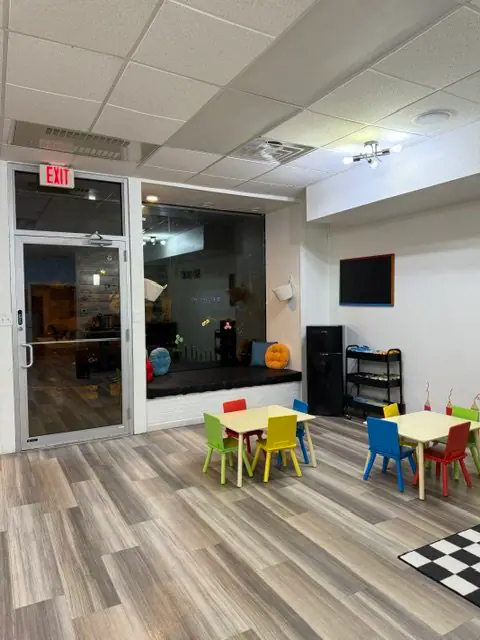 Child-sized tables and open floor space at Sensory Open Play Group.