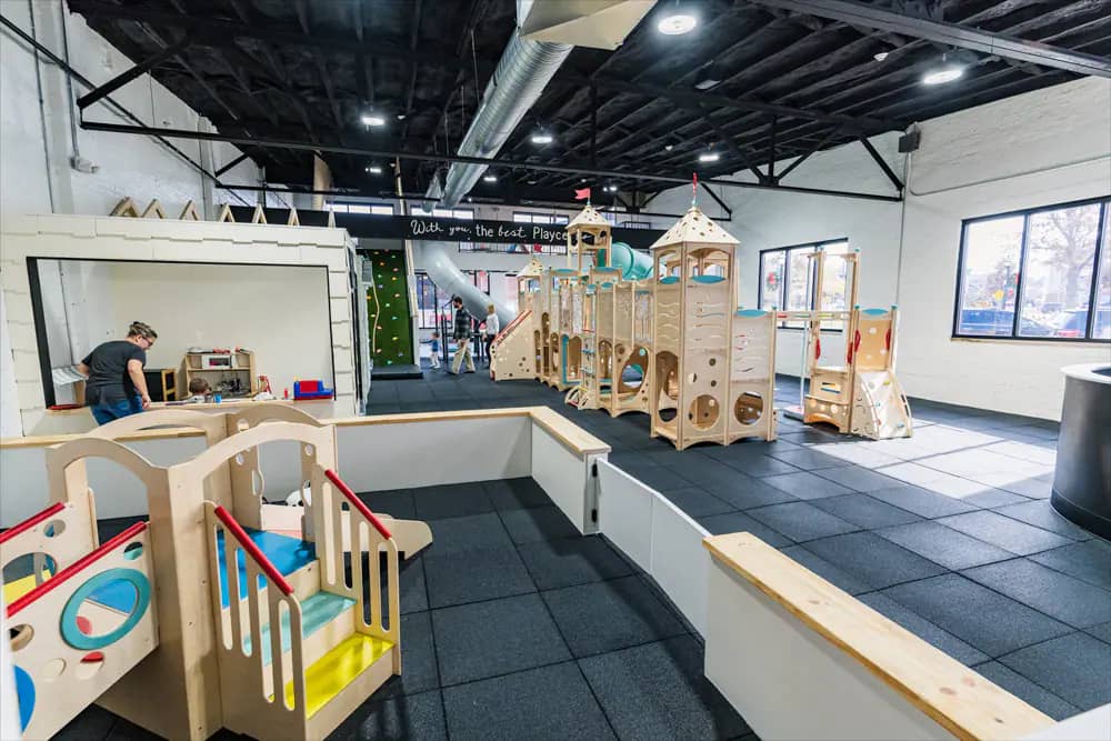 Children and caregivers inside the play area at The Playce in Jasper.