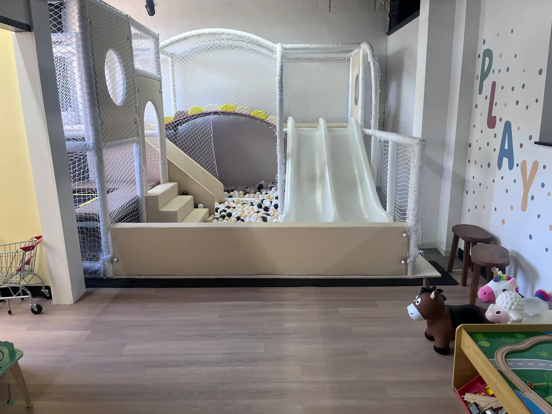 Soft-play climbing and ball-pit structure inside Little Nuggets Softplay Adventures.