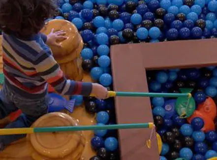 Fishing-themed play exhibit with ball-pit style elements at Hershey Children's Museum.