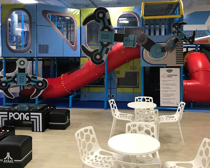 Play structure and parent seating at Marina Kids.