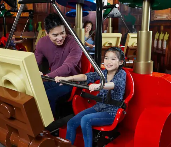 Children riding Merlin's Apprentice at LEGOLAND Discovery Center Westchester
