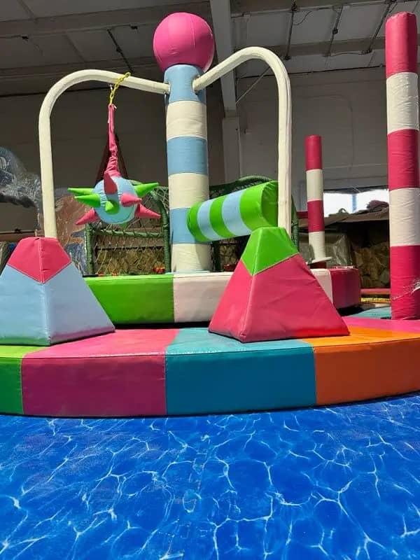 Colorful indoor playground and seating area at PlayTopia Rock Hill.