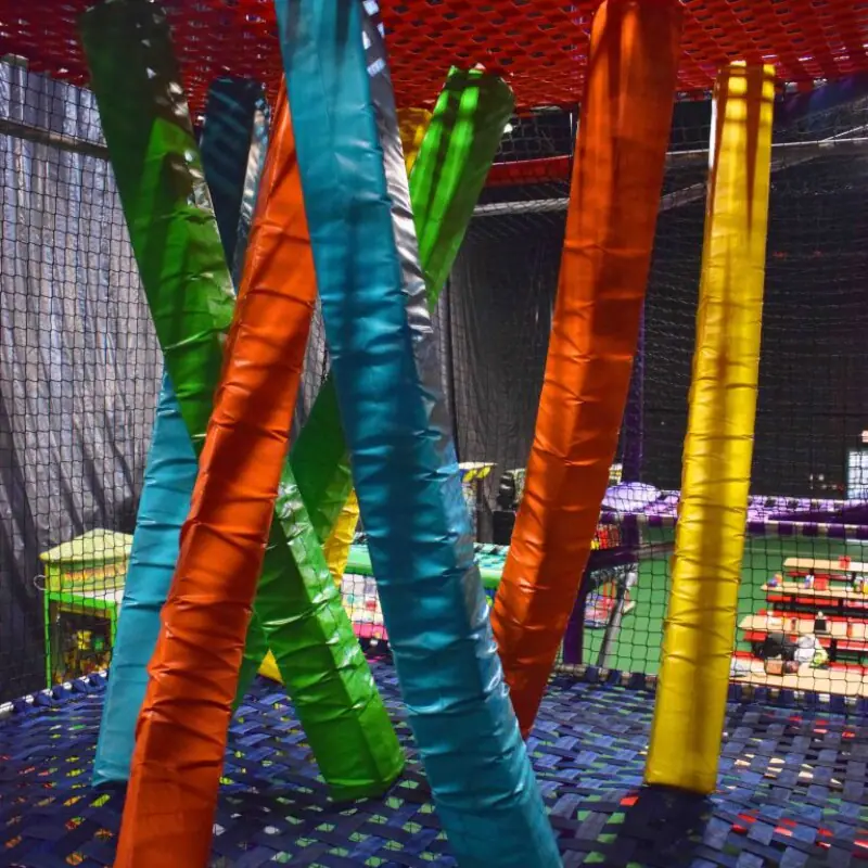 Kids climbing and playing on the indoor obstacle-style structure at Funagin's.